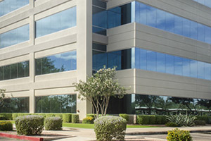 Image of a large, glass commercial building